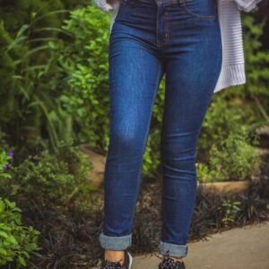 Stylish look featuring blue jeans, sneakers, and a casual top. Perfect for outdoor vibes.